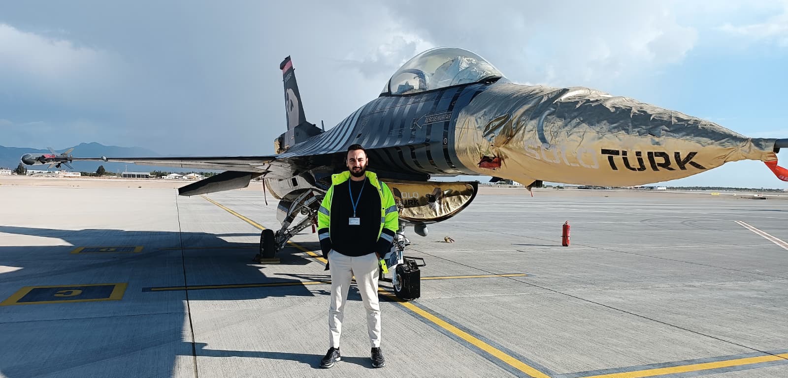 Emir Sahin on an airport apron in front of an aircraft